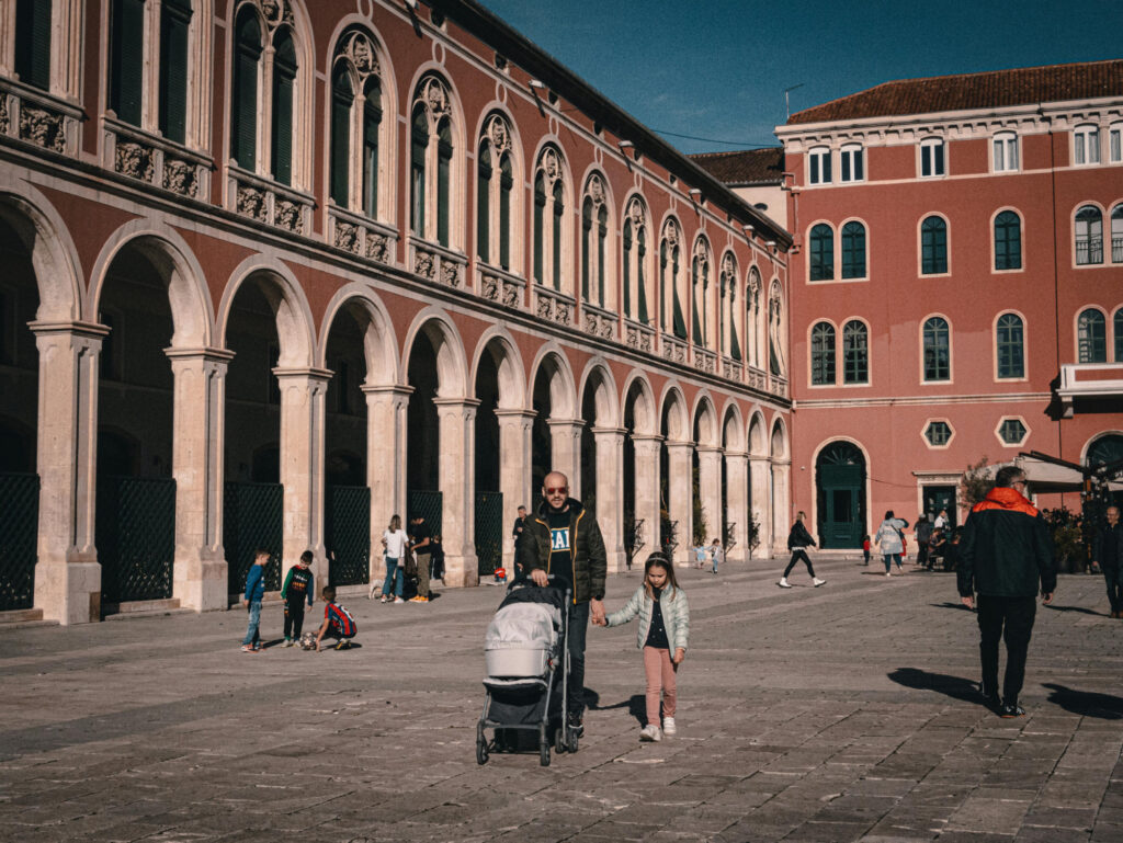 Travel stroller on cobblestone italy street rome